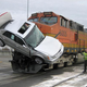 Illustration for article titled Train Skewers Car Carrier In Washington, Gets Cadillac DTS Hood Ornament